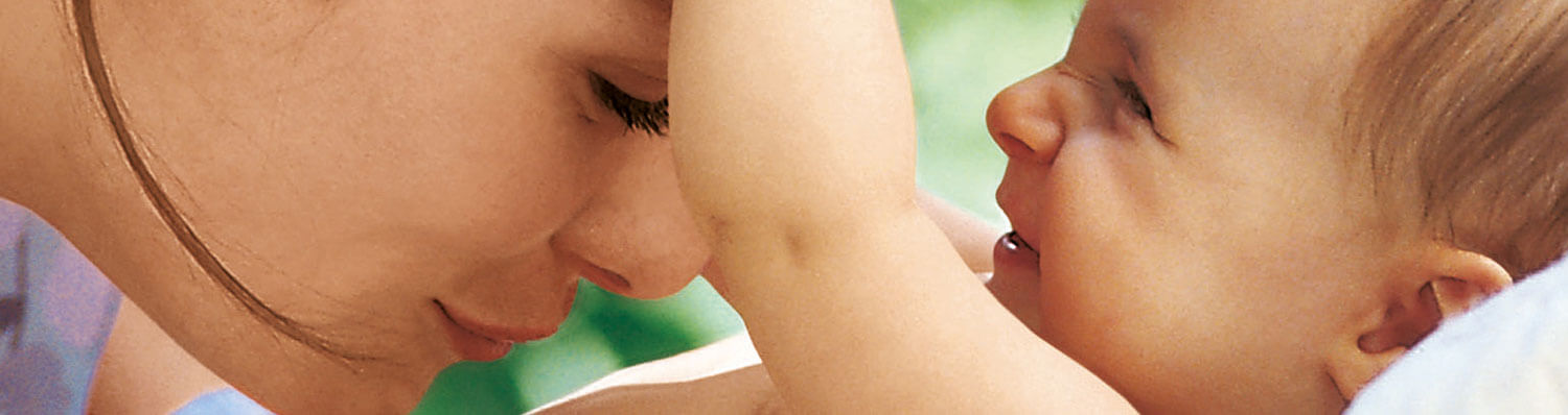 Two individuals, one with a closed eye and the other with a visible ear, are in close proximity, suggesting a moment of intimacy or connection.